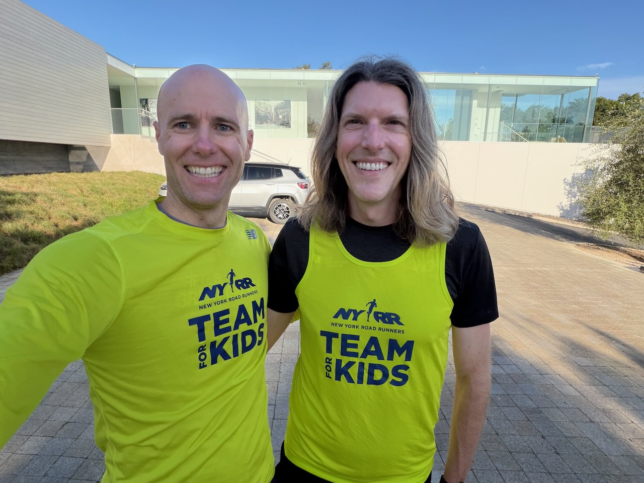 Mike Sego and a fellow runner in NYRR Team for Kids gear